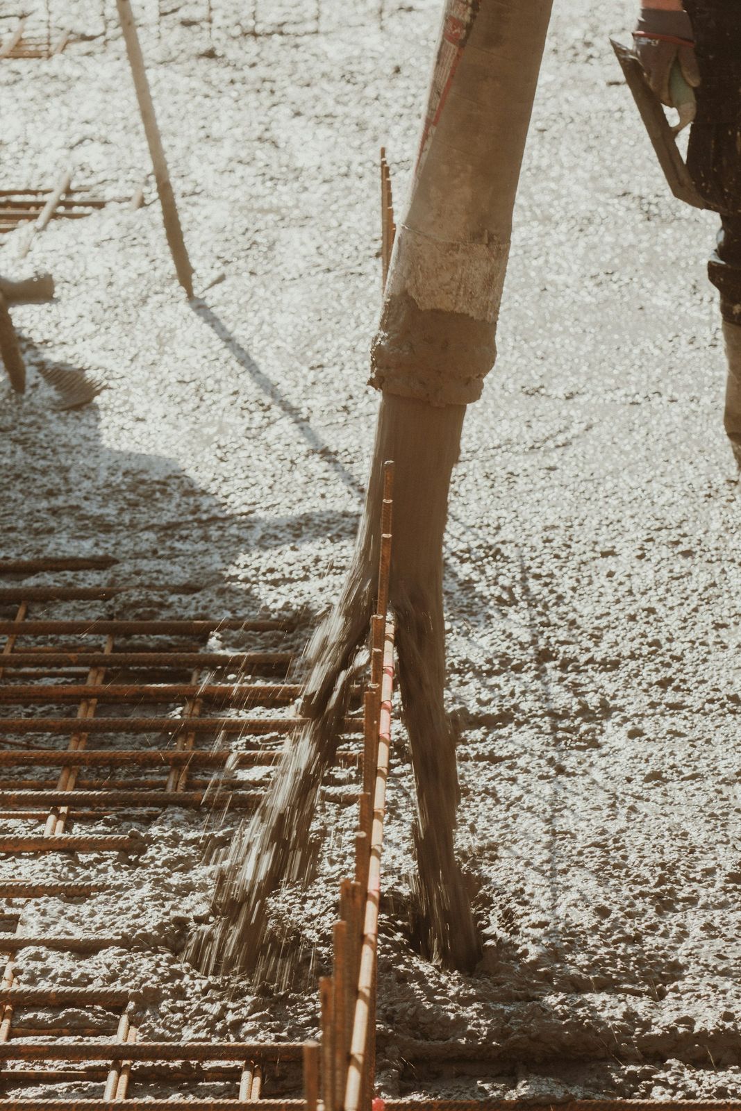 Concrete pouring onto steel reinforcement